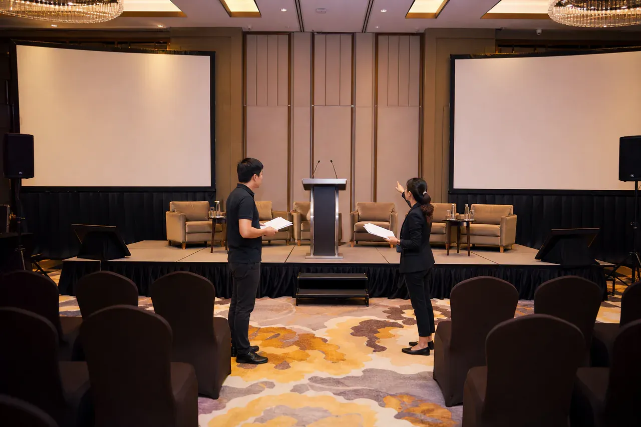 Chinese Malaysian event professionals preparing Corporate conference AV rental